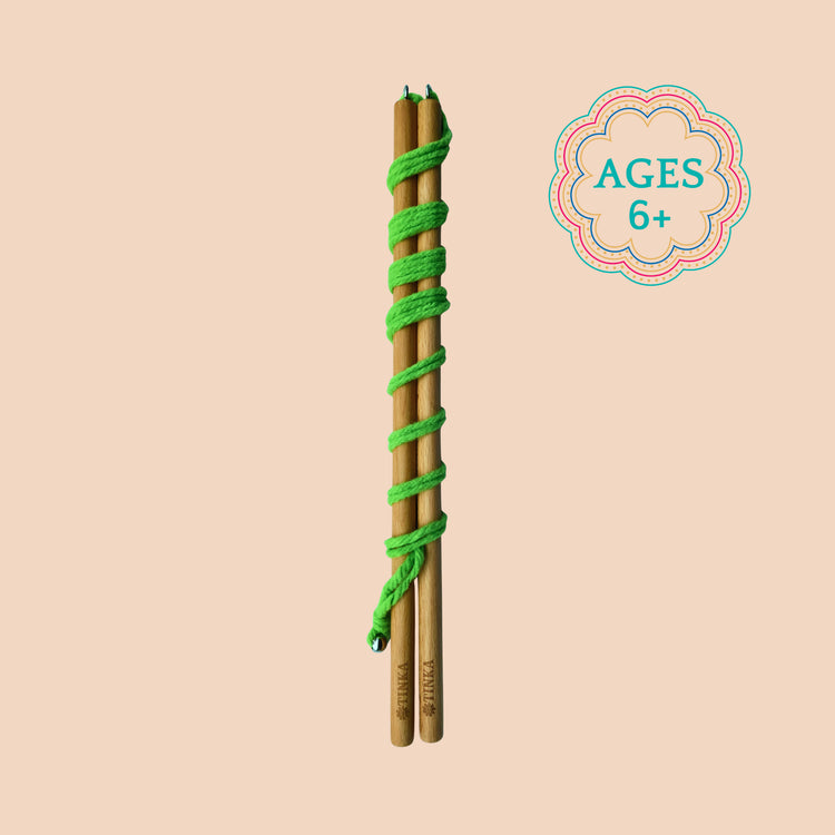 A Giant Bubble Wand with bright green yarn, shown vertically on a solid beige background with an 'AGES 6+' graphic in the top right.