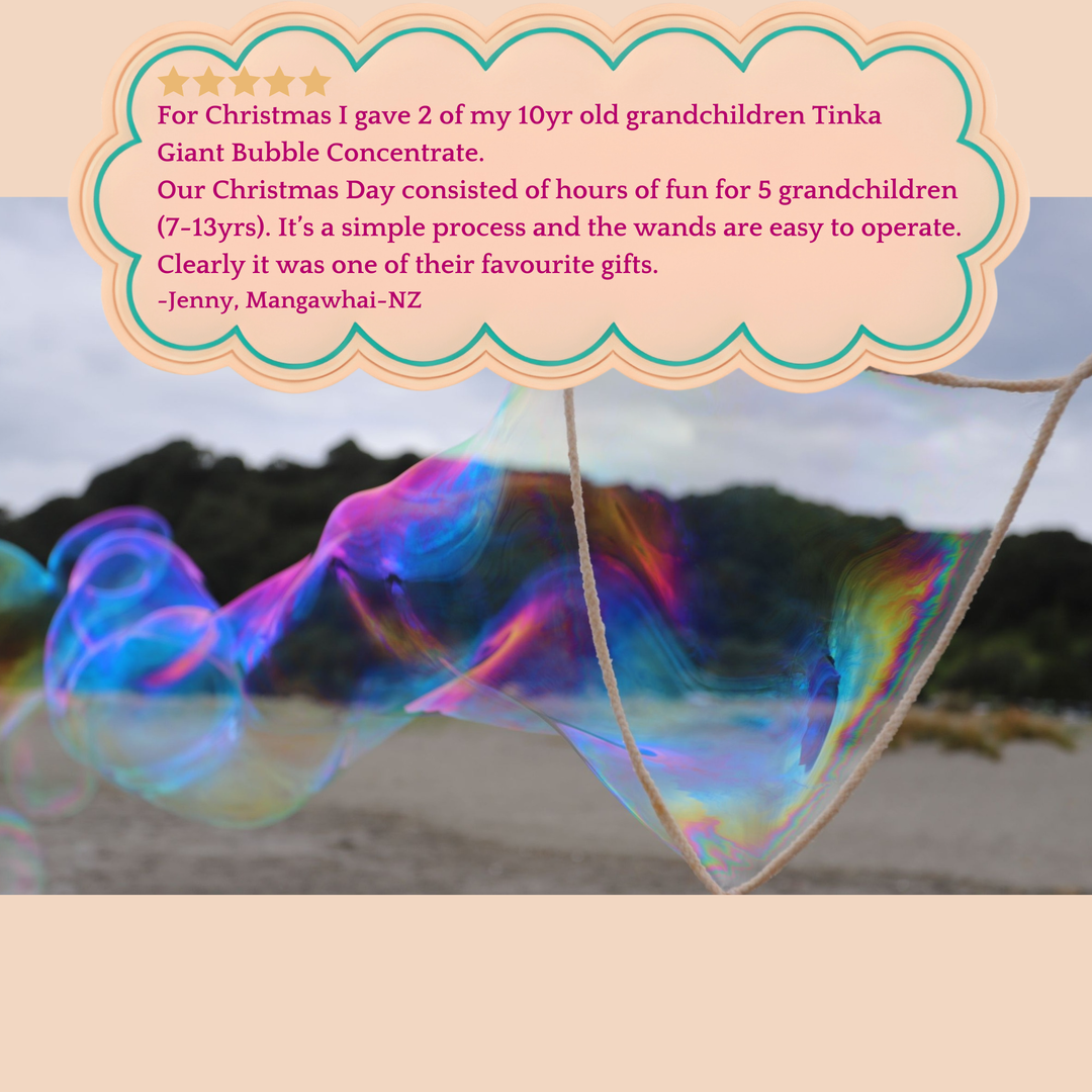 Colorful giant bubbles with a blurred natural background and a 5 star testimonial text overlay.