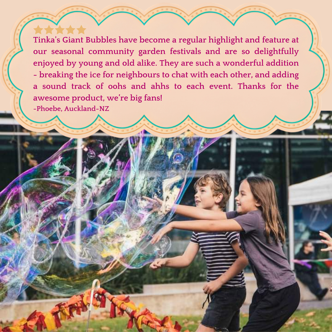 A large text review at the top and a photo of two children playing with giant, colorful bubbles in an outdoor community garden setting.