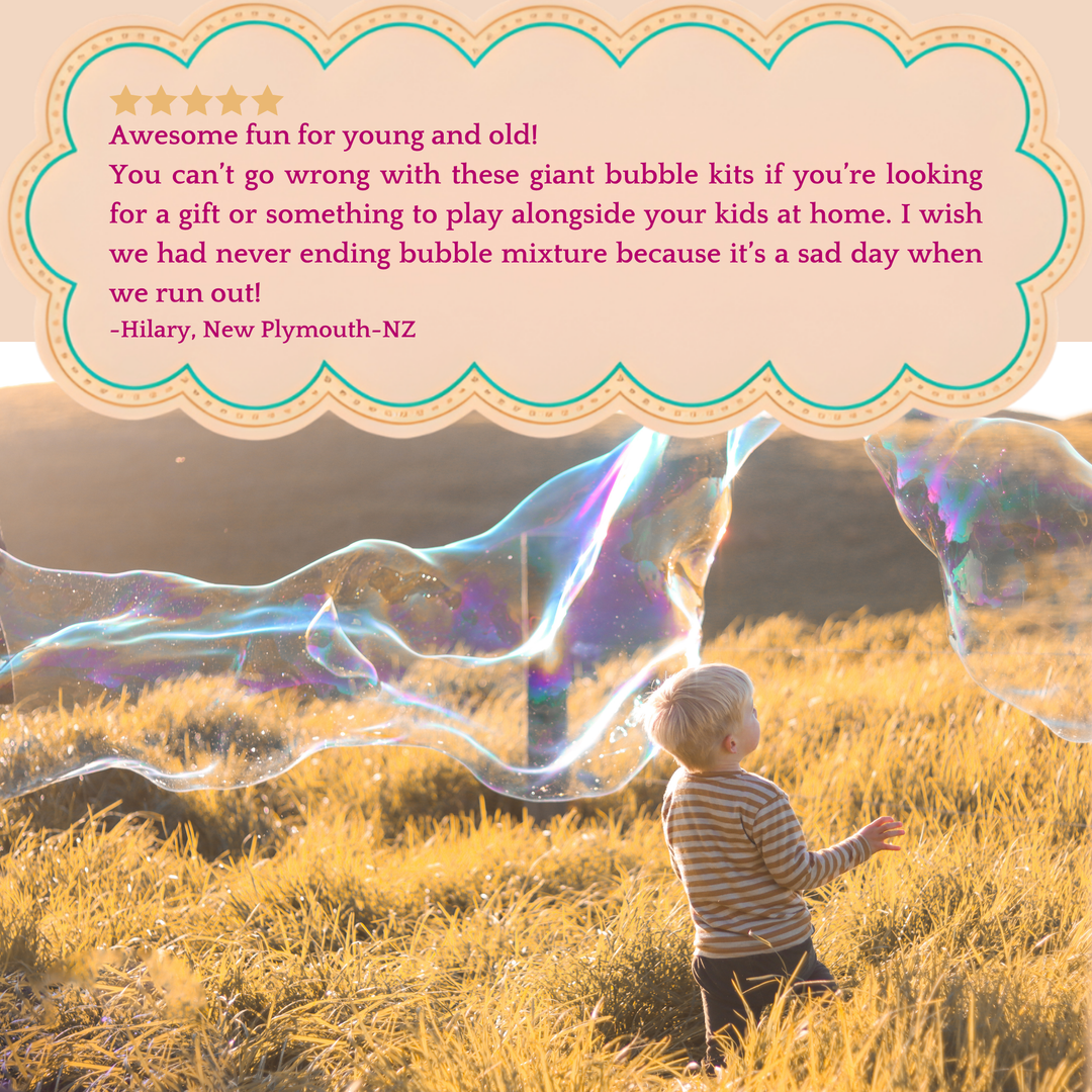 Child playing with giant bubbles in a field with a review quote overlay.